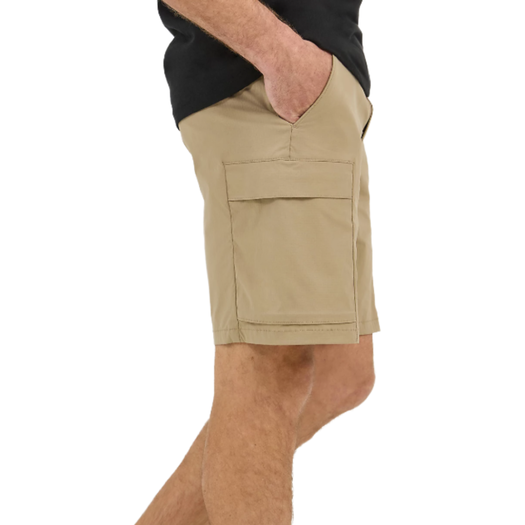 A person wearing beige cargo shorts with a side pocket, along with a black shirt.