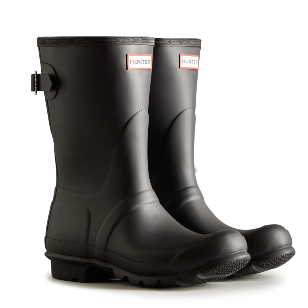 Pair of black Hunter rain boots with a buckle detail and a branded logo on the front.