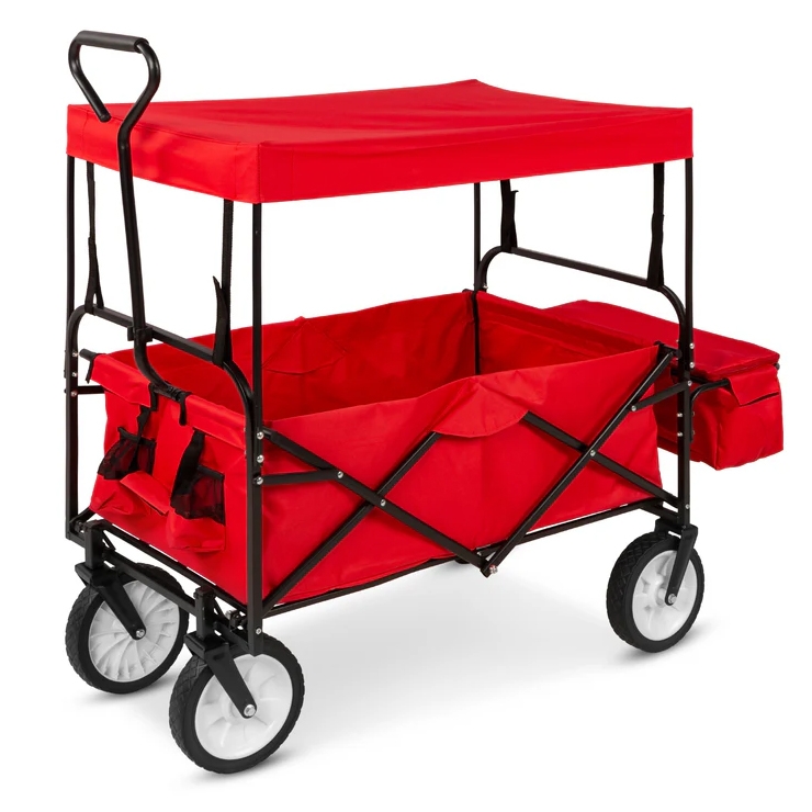 Red folding utility wagon with a black frame, featuring a canopy, four wheels, handle, side storage pouch, and additional pocket storage on the side and front.