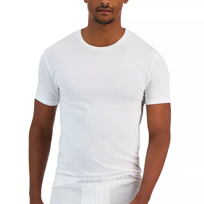 A man wearing a plain white crew-neck t-shirt and white underwear with a visible waistband logo.