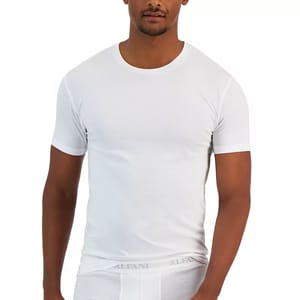 A man wearing a plain white crew-neck t-shirt and white underwear with a visible waistband logo.