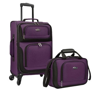 A purple luggage set includes an upright suitcase with wheels and a pull handle, alongside a matching carry-on bag with a shoulder strap.