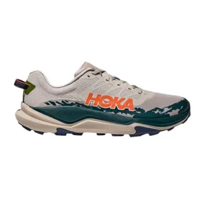 Hoka running shoe with a beige upper, green and orange accents, and a textured sole for traction.