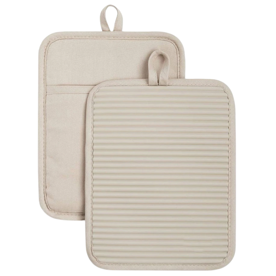 Two beige pot holders, one with a quilted fabric back and the other featuring a ridged, heat-resistant surface. Both have a loop for hanging.