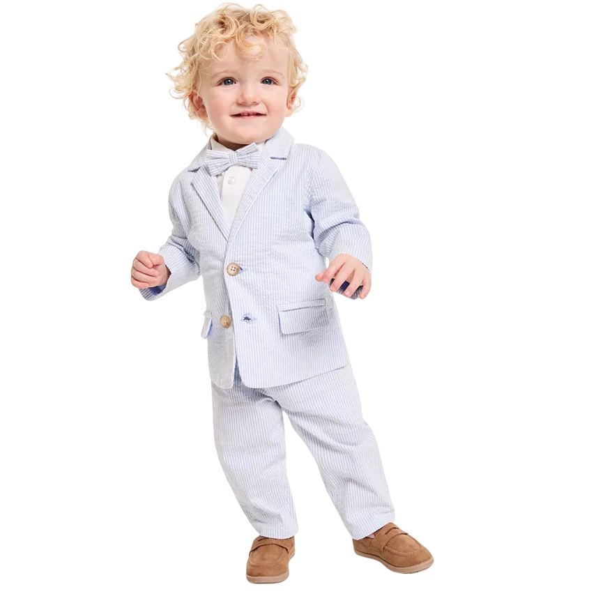 A toddler is wearing a light blue pinstripe suit with a matching bow tie, white shirt, and brown loafers.