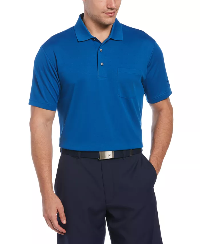 A man is wearing a royal blue polo shirt with a pocket, paired with dark pants and a black belt with a silver buckle.