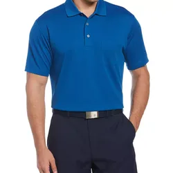 A man is wearing a royal blue polo shirt with a pocket, paired with dark pants and a black belt with a silver buckle.