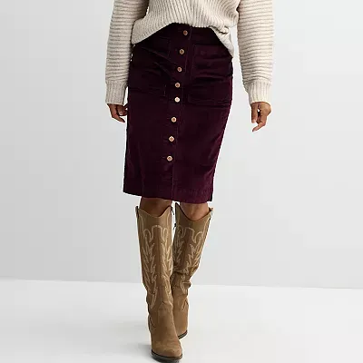 A burgundy corduroy skirt with a button-front closure and front patch pockets, paired with tan knee-high boots.