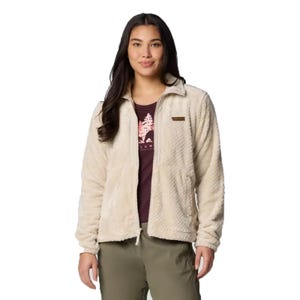 The Columbia Fire Side Full-Zip Fleece features a soft, textured cream material with a full front zipper and two pockets. It's worn over a graphic t-shirt and paired with olive pants.