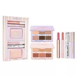 Makeup set featuring two eyeshadow palettes, two lip crayons, a mascara, and a liquid eyeliner.