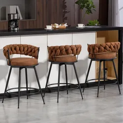 Three bar stools with brown, cushioned, tufted backs and seats, supported by black metal frames, are placed beside a modern counter with coffee and snacks.