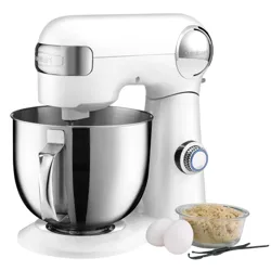 A white stand mixer with a stainless steel mixing bowl, accompanied by two eggs, vanilla beans, and a bowl of brown sugar.