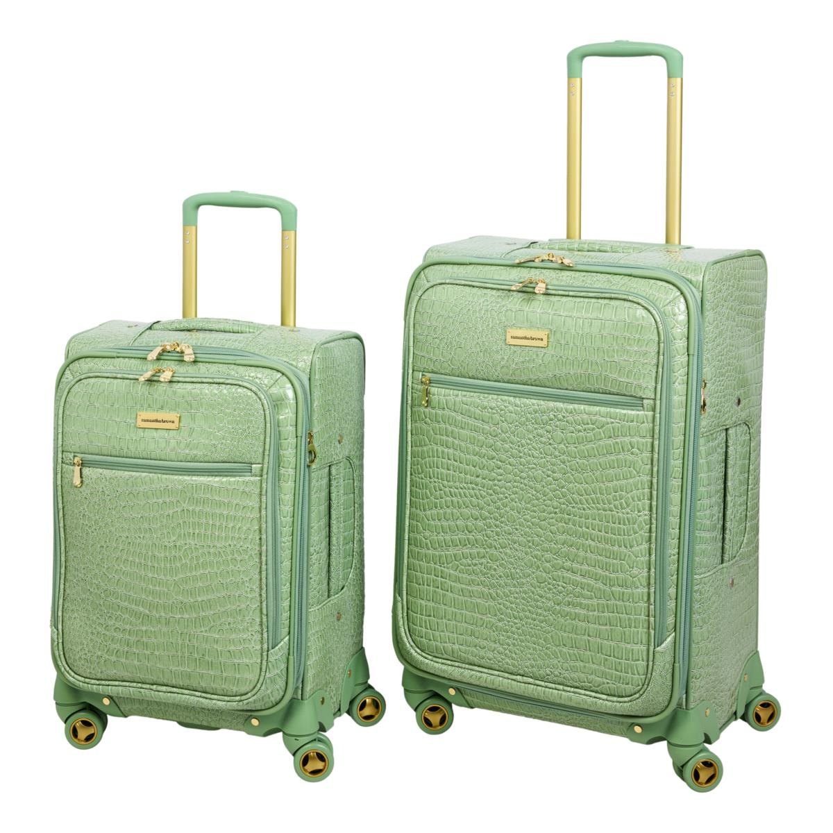 Samantha Brown 2pc Luggage Set includes two green suitcases with a crocodile texture, gold handles, and wheels, featuring front zipper pockets.