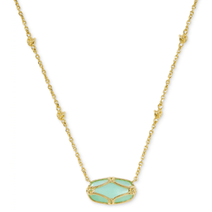 A gold chain necklace featuring a green oval pendant with intricate gold detailing.