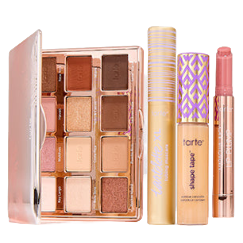 A makeup set featuring a neutral eyeshadow palette, mascara, concealer, and a pink lip product, all with sleek packaging.