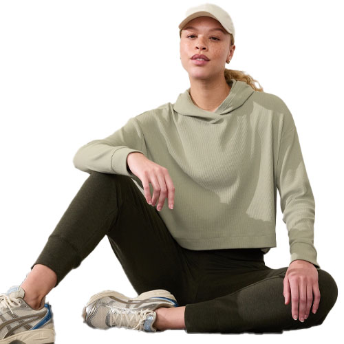 A light green, long-sleeve hooded sweatshirt with a relaxed fit, featuring ribbed fabric and a drop shoulder design.