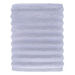 A light gray, ribbed cylindrical object made of plush, textured material, likely a microfiber towel or sleeve.