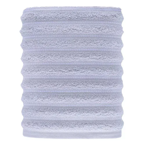 A light gray, ribbed cylindrical object made of plush, textured material, likely a microfiber towel or sleeve.