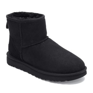 A black suede ankle boot with a plush inner lining and a flat rubber sole, designed for warmth and comfort.
