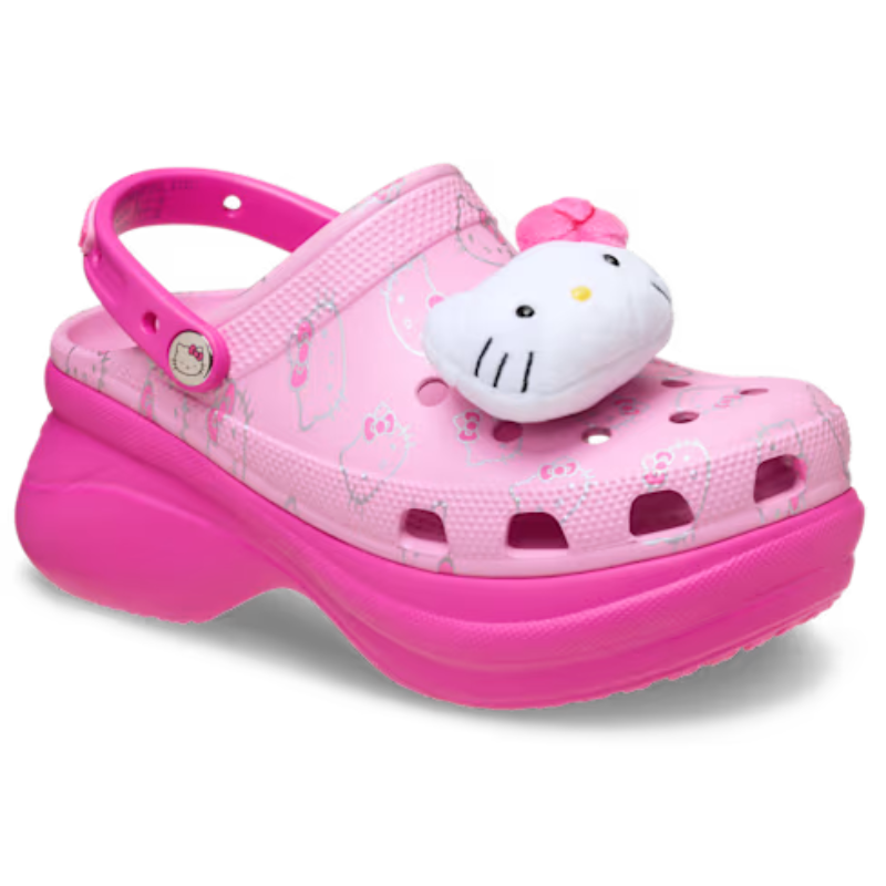 A pink platform clog-style shoe with a plush Hello Kitty character and Hello Kitty graphics, featuring a heel strap for secure fit.