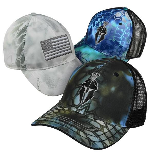 Three caps featuring camouflage patterns: two with a Spartan helmet logo in blue and green tones, and one in grey with a blacked-out American flag patch.