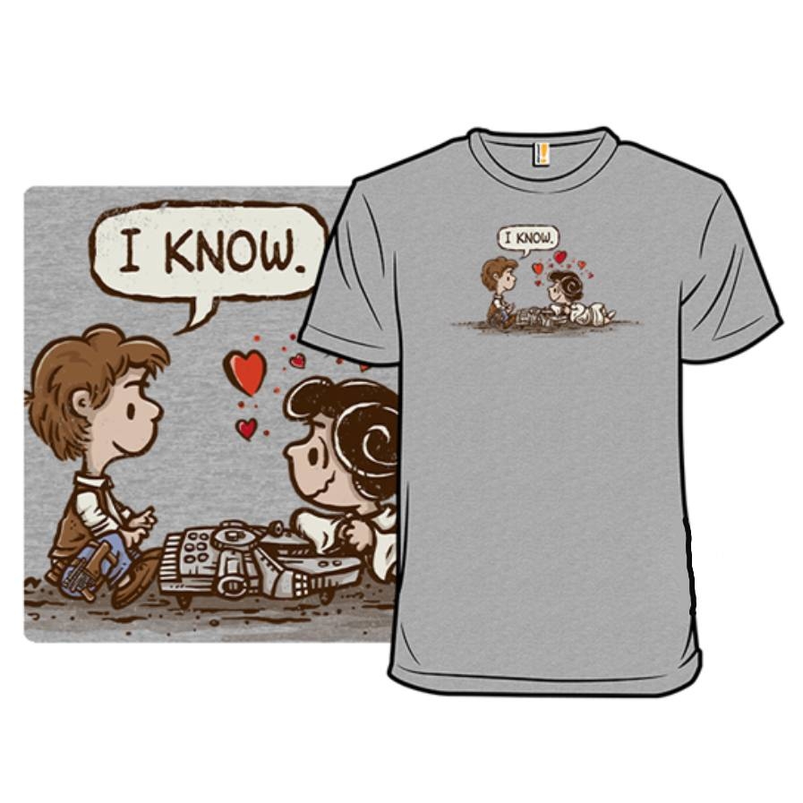 A gray T-shirt featuring a cartoon-style graphic of two characters, referencing a classic scene with the phrase \“I Know\“ in a speech bubble, surrounded by hearts.