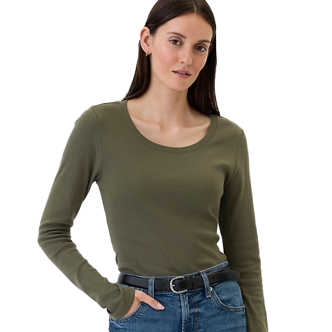 A woman wearing a fitted, long-sleeve olive green tee with a scoop neckline, paired with blue jeans and a black belt.