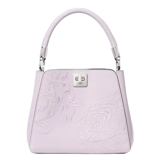 Lavender handbag with floral embossed design, featuring a metal clasp and a structured top handle.