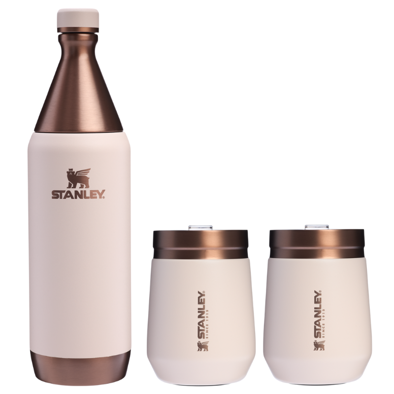 Stanley Wine Set includes a sleek, insulated bottle and two matching tumblers, all in a modern beige and bronze color. Each piece features the Stanley logo, designed for keeping beverages at the desired temperature.