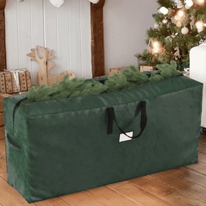 Green storage bag designed for holding a disassembled artificial Christmas tree, with handles for easy carrying and a partially open top showing tree branches.