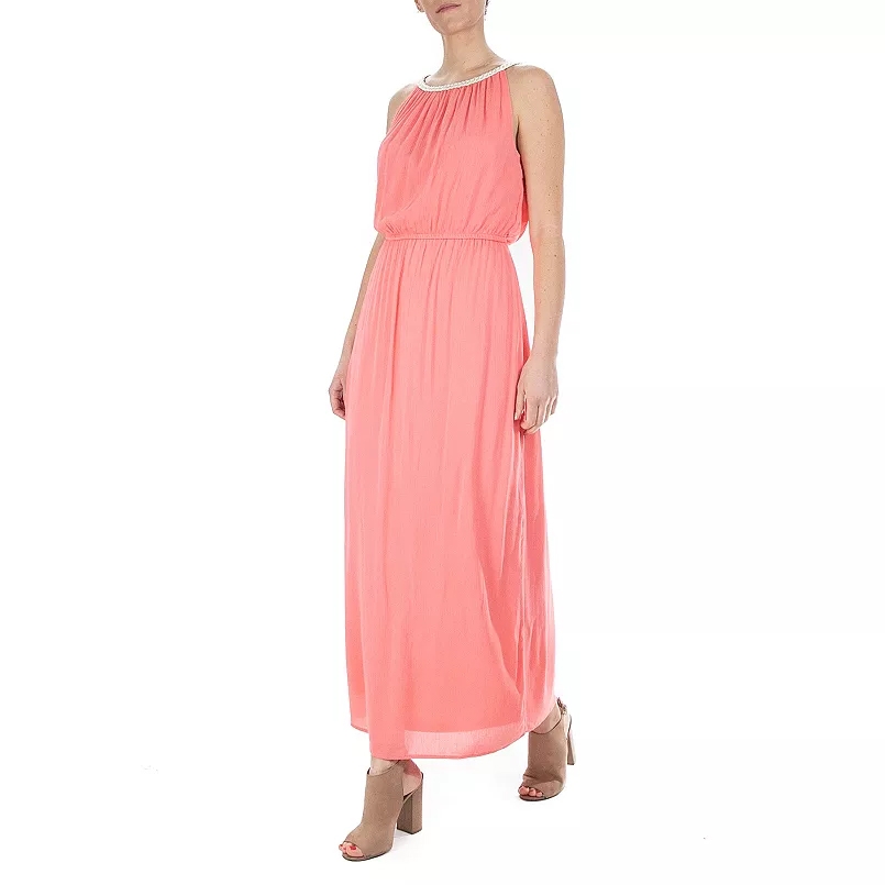 Coral-colored sleeveless maxi dress with a blouson top, elastic waistband, and embellished neckline, paired with tan block-heeled sandals.