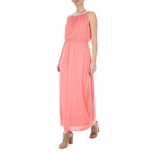 Coral-colored sleeveless maxi dress with a blouson top, elastic waistband, and embellished neckline, paired with tan block-heeled sandals.