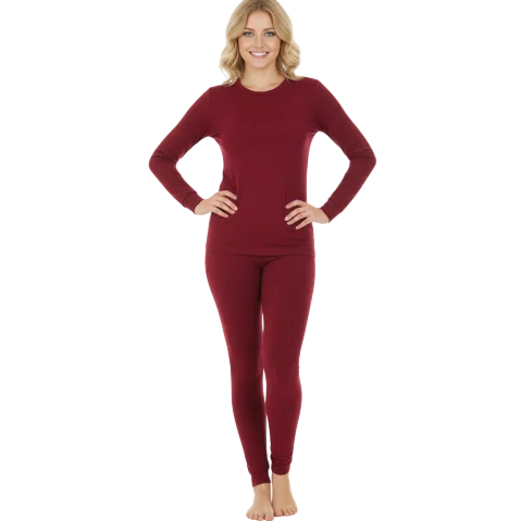 A person is wearing a matching set of maroon long-sleeve top and leggings, suitable for casual wear or lounging.
