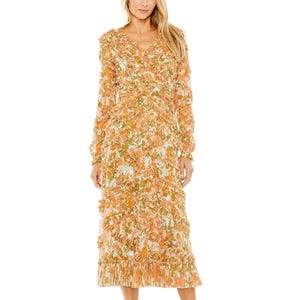 A long-sleeved, floral-patterned dress in shades of peach and orange with a V-neckline and a pleated hem.