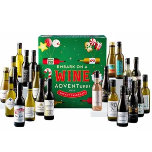 A wine advent calendar featuring various miniature bottles of wine and sparkling wine, with a festive green box labeled \“Embark on a Wine Adventure! 2023.\“
