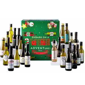 A wine advent calendar featuring various miniature bottles of wine and sparkling wine, with a festive green box labeled \“Embark on a Wine Adventure! 2023.\“