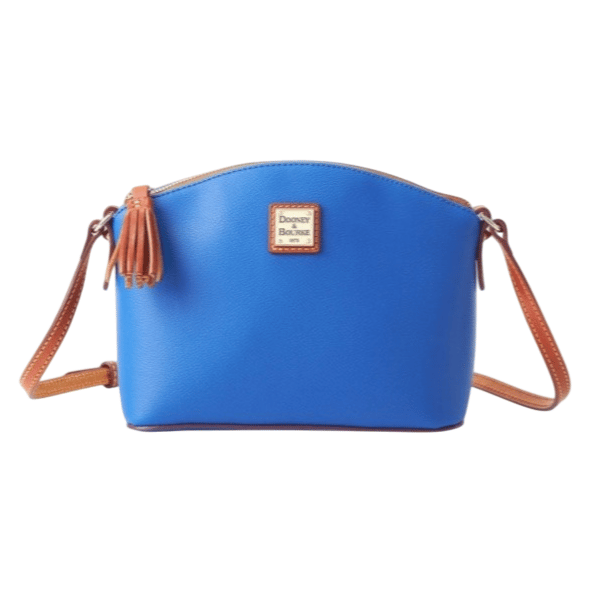 A blue Dooney & Bourke crossbody bag with brown leather straps and a tassel detail.