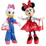 Fashion dolls of animated characters in stylish outfits; one wears a denim jumpsuit and pink accessories, while the other sports a red dress, silver jacket, and matching bow.