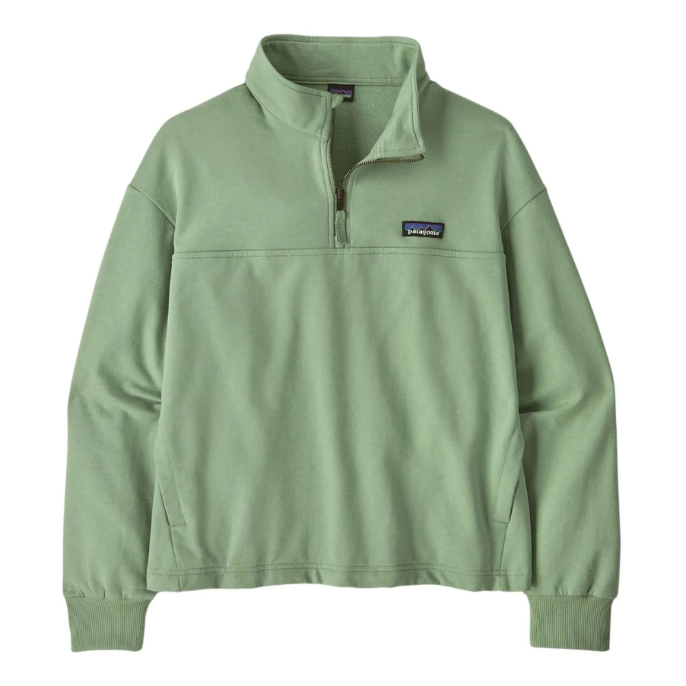 A light green Patagonia quarter-zip pullover with a high collar and ribbed cuffs, featuring the brand logo on the chest.