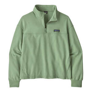 A light green Patagonia quarter-zip pullover with a high collar and ribbed cuffs, featuring the brand logo on the chest.