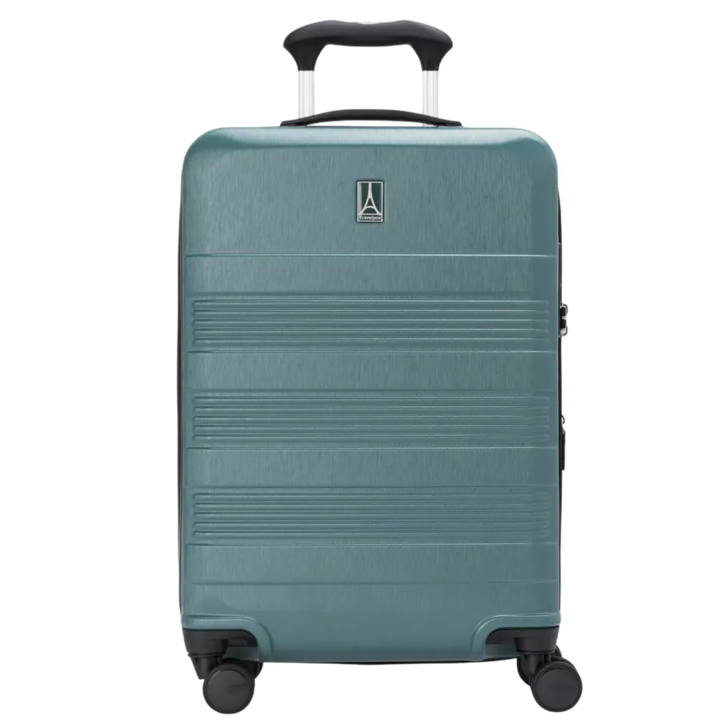 Teal hard-shell suitcase with four spinner wheels, telescopic handle, and horizontal ridged design.