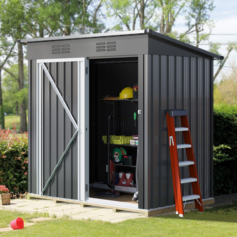 A metal garden shed with open doors revealing stored items like tools, a ladder, and gardening equipment.