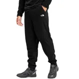 A person is wearing black fleece sweatpants with The North Face logo, paired with black hiking shoes.