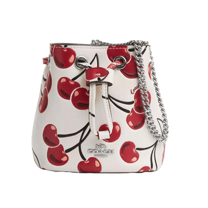 Coach Outlet Drawstring Wristlet featuring a white base with a cherry print design, drawstring closure, and a silver chain strap.