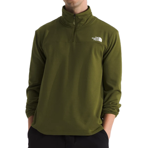 The North Face Cedar Trail Fleece features a quarter-zip design in olive green with long sleeves and a high collar, displaying the brand's logo on the chest.