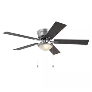 Ceiling fan with a central light fixture and four dark blades, featuring two pull chains.