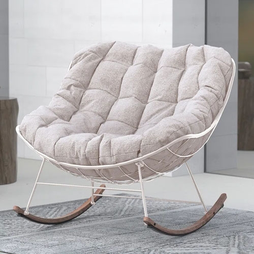 Outdoor steel rocker featuring a curved design with a light beige cushion, seated on a metal frame with wooden rocking legs, ideal for comfortable lounging.