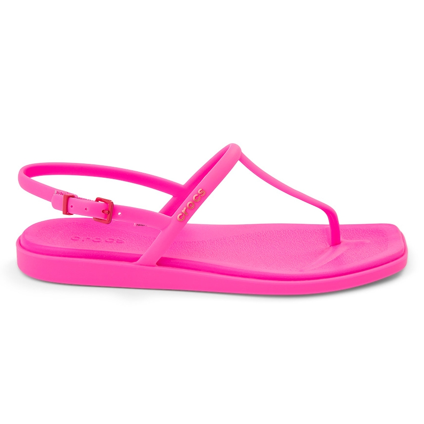 Pink Crocs sandal with an adjustable ankle strap, featuring a flat sole and toe post design.