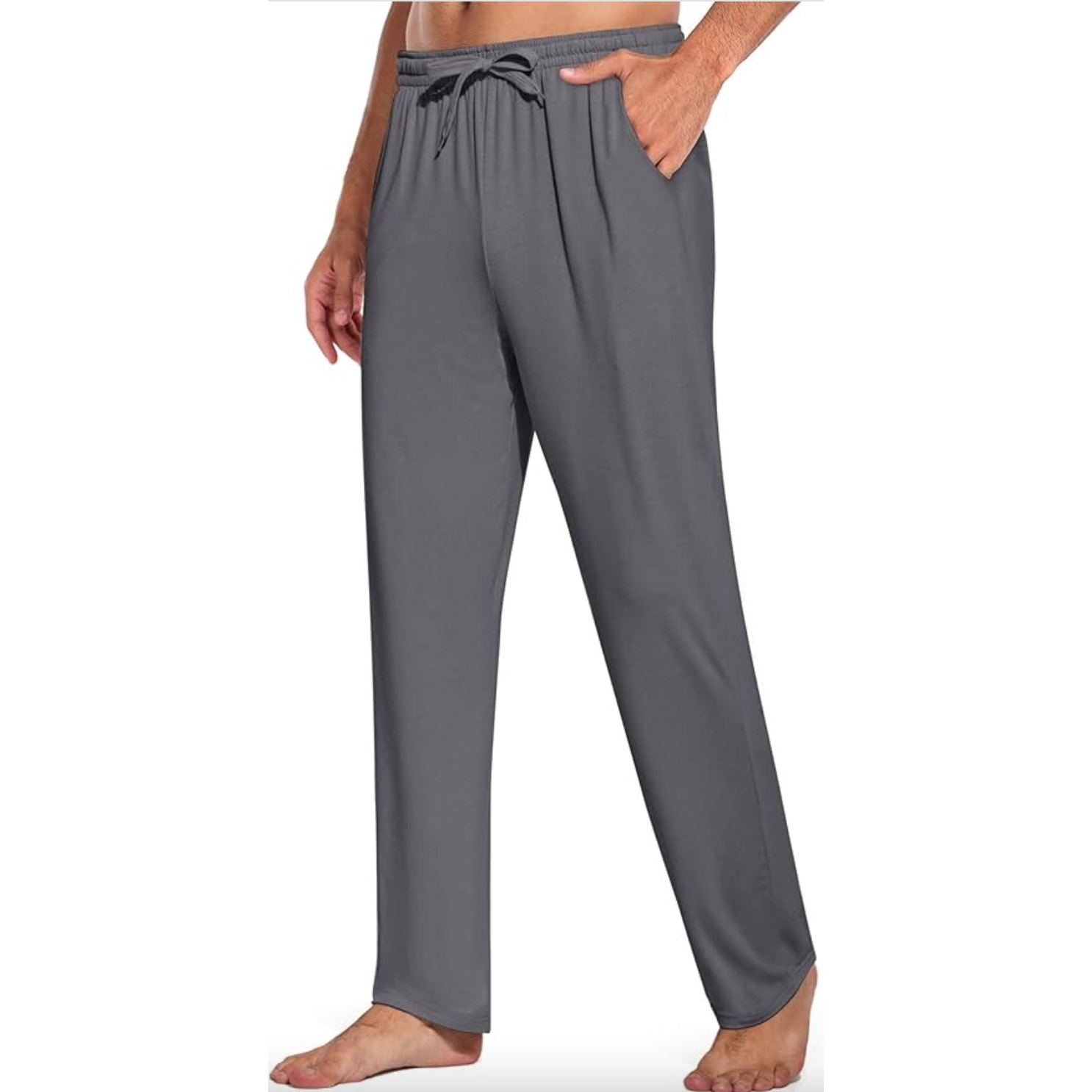 Gray drawstring pajama pants with a relaxed fit, featuring pockets and elastic waistband. Worn by a barefoot person.