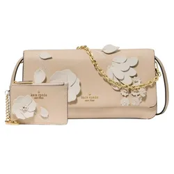 A beige Kate Spade New York handbag with floral embellishments and a matching cardholder attached by a gold chain.